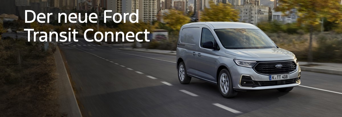 Der neue Ford Transit Connect fährt auf einer Stadtstraße mit modernen Gebäuden im Hintergrund.